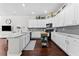 Well-equipped kitchen featuring white cabinets, granite countertops, and a kitchen island at 15212 Kestrelrise Dr, Lithia, FL 33547