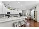 Modern kitchen with white cabinets, granite countertops, and breakfast nook at 15212 Kestrelrise Dr, Lithia, FL 33547