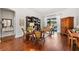 Bright and airy living room with hardwood floors, comfortable seating, and built-in shelving at 15212 Kestrelrise Dr, Lithia, FL 33547