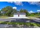 Detached garage with a large concrete slab at 8921 Honeywell Rd, Gibsonton, FL 33534