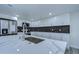 Modern kitchen with white cabinets, quartz countertops and large island at 8921 Honeywell Rd, Gibsonton, FL 33534