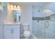 Updated bathroom with white vanity, marble shower, and modern fixtures at 8921 Honeywell Rd, Gibsonton, FL 33534