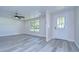 Living room with gray flooring and ceiling fan at 8921 Honeywell Rd, Gibsonton, FL 33534