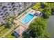 Community pool view from above with surrounding patio and lush landscaping at 7050 Sunset S Dr # 912, South Pasadena, FL 33707