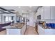 Spacious kitchen with white cabinets, granite countertops and island at 4311 Pullet Ct, Lakewood Ranch, FL 34211