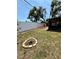 The lawn is open and has a small flowerbed surrounded by bricks at 11452 81St Pl, Seminole, FL 33772