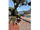 View of brick path leading to a backyard shed at 11452 81St Pl, Seminole, FL 33772
