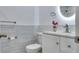 Neutral bathroom featuring a single sink vanity with white countertops and a decorative light fixture at 11452 81St Pl, Seminole, FL 33772