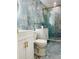 Stylish bathroom features blue marble-style tile, hexagon floor tile, and modern white cabinets at 11452 81St Pl, Seminole, FL 33772
