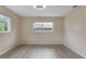Bright bedroom with two windows providing natural light and a ceiling fan at 11452 81St Pl, Seminole, FL 33772