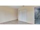 Bedroom with vinyl floors, closet, and bathroom with a shower at 11452 81St Pl, Seminole, FL 33772