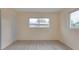 Bedroom with two windows providing natural light and a ceiling fan at 11452 81St Pl, Seminole, FL 33772