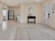 This living room features ceramic tile that transitions to laminate, a modern door, and a modern color scheme at 11452 81St Pl, Seminole, FL 33772