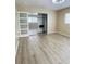 Primary bedroom featuring a mirrored closet with shelving and a ceiling fan at 11452 81St Pl, Seminole, FL 33772