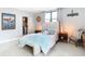 Bright bedroom with a comfy bed and access to closet at 3820 Gulf Blvd # 1001, St Pete Beach, FL 33706