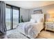 Bedroom with white bedding and ocean view at 3820 Gulf Blvd # 1001, St Pete Beach, FL 33706