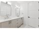 Bright bathroom featuring a double sink vanity with modern fixtures and a light color palette at 4625 W El Prado Blvd, Tampa, FL 33629