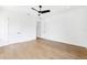Modern bedroom boasts wood floors, ceiling fan, recessed lights, and neutral color palette at 4625 W El Prado Blvd, Tampa, FL 33629