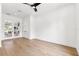 Bedroom featuring wood floors, recessed lighting, ceiling fan and glass paneled doors at 4625 W El Prado Blvd, Tampa, FL 33629