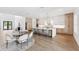 Open concept kitchen featuring an island with seating, modern appliances, and bright, airy design at 4625 W El Prado Blvd, Tampa, FL 33629