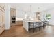 Bright, airy kitchen featuring a large island with seating, stainless steel appliances, and modern finishes at 4625 W El Prado Blvd, Tampa, FL 33629