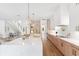Spacious modern kitchen with quartz countertops, light wood cabinets, stainless appliances and pendant lighting at 4625 W El Prado Blvd, Tampa, FL 33629
