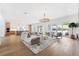 Expansive living room with open kitchen, comfortable seating, and access to outdoor space at 4625 W El Prado Blvd, Tampa, FL 33629