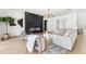 Comfortable living room with a modern fireplace and stylish decor and lighting at 4625 W El Prado Blvd, Tampa, FL 33629