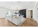 Spacious living room with modern fireplace and glass doors leading to an outdoor space at 4625 W El Prado Blvd, Tampa, FL 33629