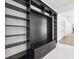 Mudroom features built-in bench with storage and custom shelving at 4625 W El Prado Blvd, Tampa, FL 33629
