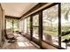 Relaxing screened porch with comfy seating and a view of the backyard at 12300 Vonn Rd # 7101, Largo, FL 33774