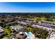 Aerial view of community, tennis court, and pool at 12300 Vonn Rd # 7101, Largo, FL 33774