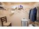 Walk-in closet with shelving and hanging rods at 12300 Vonn Rd # 7101, Largo, FL 33774