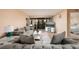 Bright living room with comfy sofas, a coffee table, and a view to the patio at 12300 Vonn Rd # 7101, Largo, FL 33774