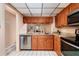 Modern kitchen with stainless steel appliances and granite countertops at 12300 Vonn Rd # 7101, Largo, FL 33774