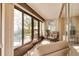 Cozy screened-in porch with comfortable seating and a view of the patio at 12300 Vonn Rd # 7101, Largo, FL 33774