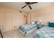 Guest bedroom with twin beds and ceiling fan at 12300 Vonn Rd # 7101, Largo, FL 33774