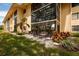 Spacious patio with multiple chairs and a fire pit, surrounded by greenery at 12300 Vonn Rd # 7101, Largo, FL 33774