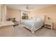 Bedroom with queen bed, dresser and ceiling fan at 12300 Vonn Rd # 7101, Largo, FL 33774