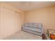 Small guest bedroom with sofa and closet at 12300 Vonn Rd # 7101, Largo, FL 33774