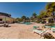 Community pool with lounge chairs and patio area at 12300 Vonn Rd # 7101, Largo, FL 33774