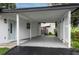 Covered carport with additional storage and privacy screen at 11452 81St Pl, Seminole, FL 33772