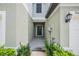 Front entrance of a two-story house with a walkway and landscaping at 2166 Great Sapphire Ln, Lutz, FL 33558