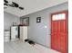 Home entryway with red door and gray walls at 11109 Sumner Rd, Wimauma, FL 33598