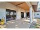 Covered patio with sliding glass doors and a grill at 11109 Sumner Rd, Wimauma, FL 33598