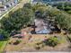 Aerial view showing a single-story home, pool, and large backyard on a spacious lot at 11109 Sumner Rd, Wimauma, FL 33598