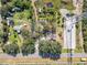Aerial view of property showing home, outbuildings, and surrounding land at 11109 Sumner Rd, Wimauma, FL 33598