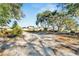 Vacant lot ready for development, featuring ample space and a partially cleared area at 11109 Sumner Rd, Wimauma, FL 33598