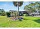 Single-wide manufactured home on a spacious lot with mature trees and landscaping at 11109 Sumner Rd, Wimauma, FL 33598