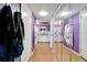 Bathroom with double vanity, mirrored walls, and purple decor at 11109 Sumner Rd, Wimauma, FL 33598
